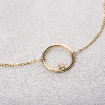 Bracelet femme fil rond sertie d'un diamant 0,03 carats en or 18 carats.