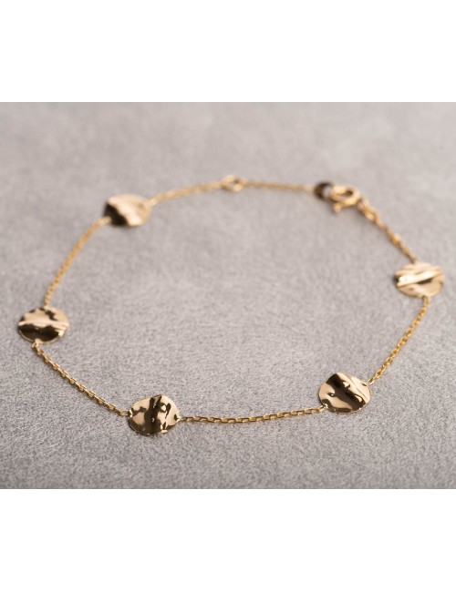 Bracelet femme orné de cinq ronds froissés en or 18 carats.